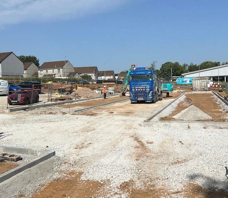 Live DMV groundworks site at ALDI Liskeard with kerbs, sub-base and tipper
